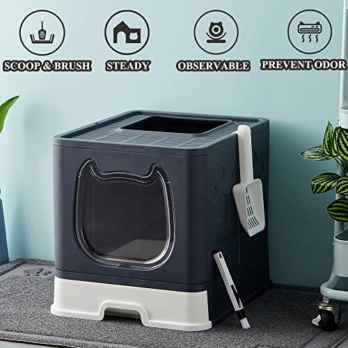 Dark blue cat litter box with scoop, odor prevention features.