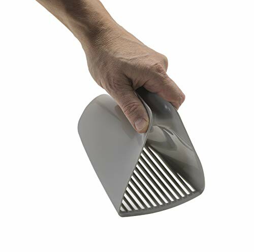 Hand holding a gray handheld slicing tool with slotted blades.